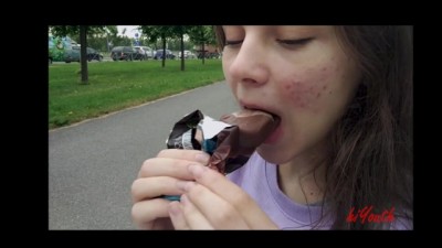 Very Cute Girl Enjoying Icecream Public
